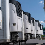 Dozens of refrigerated trucks and containers