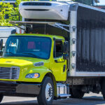 Yellow and black Reefer box truck