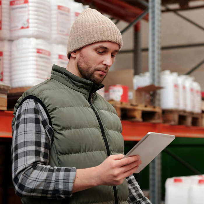 Warehouse employee looking at tablet